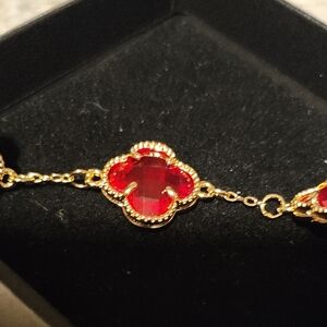 Elegant Gold and Red Clover Bracelet